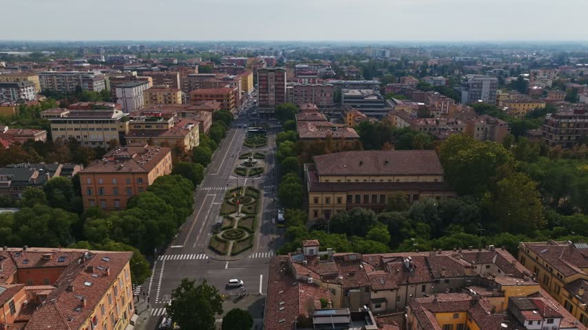 Aerial drone view of Teatro Storchi in Modena, Italy, showcasing the historic theater, elegant architecture, surrounding streets, and urban cityscape in the heart of Emilia-Romagna.
