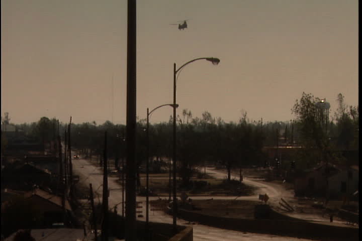 Helicopter passes over abandoned neighborhood in New Orleans after Hurricane Katrina (October 2005).