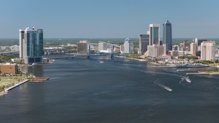 Aerial view of the Jacksonville skyline and Main Street Bridge over the St. Johns River in Jacksonville, Florida, United States.