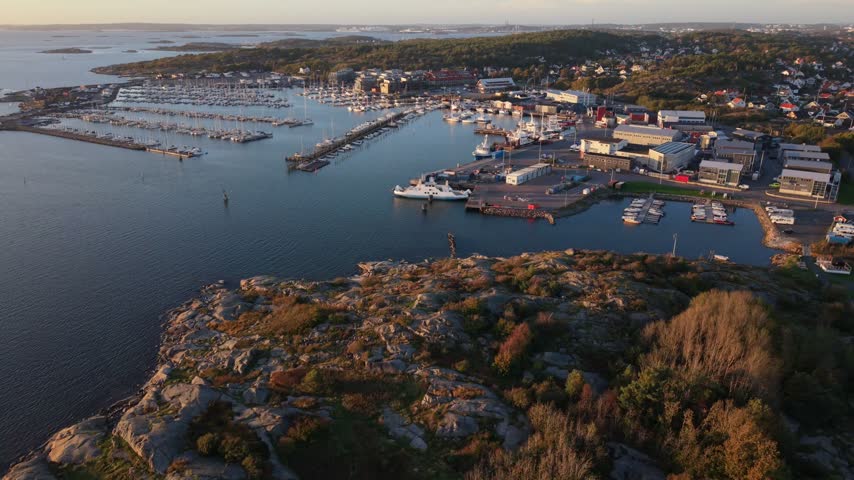 Aerial view of Fiskeback harbor with boats docked in the marina and surrounding rocky coastline in Gothenburg, Vastra Gotaland County, Sweden.