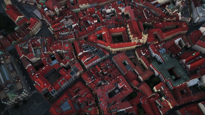 Dense Historic Neighbourhoods With Distinctive Red Rooftops And Traditional Architecture In Prague, Czech Republic. Aerial Top-down Shot