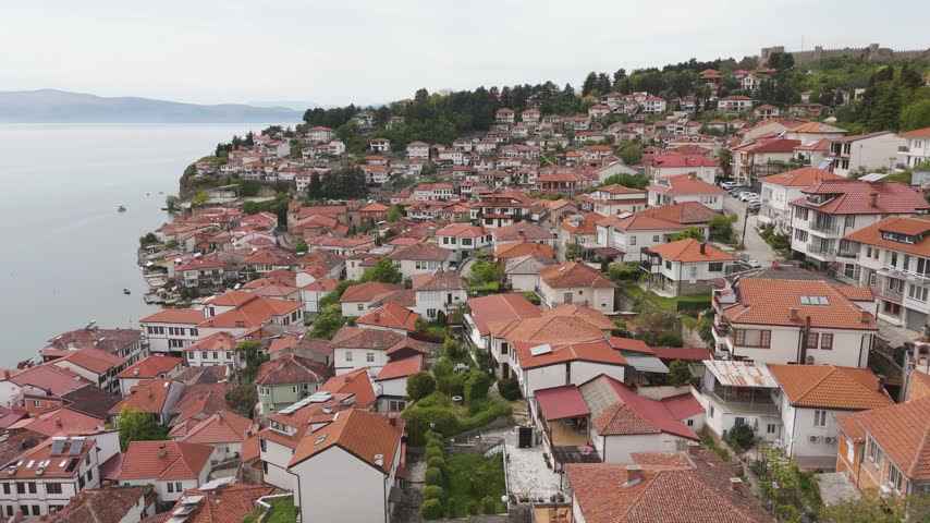Historic residential quarter in North Macedonia with whitewashed homes, small gardens and red tile roofs below the walls of Samuel