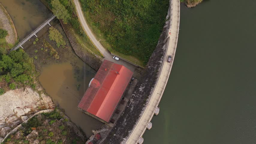 Aerial view of Zlotnicka Dam with its red-roofed power station and reservoir in Zlotniki Lubanskie, Lower Silesian Voivodeship, Poland.