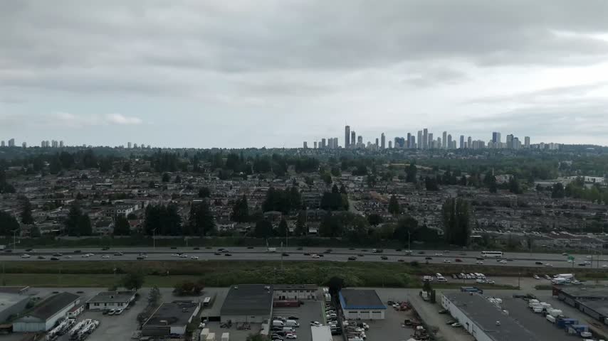 Traffic Over Lougheed Highway Along Brentwood Neighborhood Of Burnaby In British Columbia, Canada. Aerial Tracking Shot