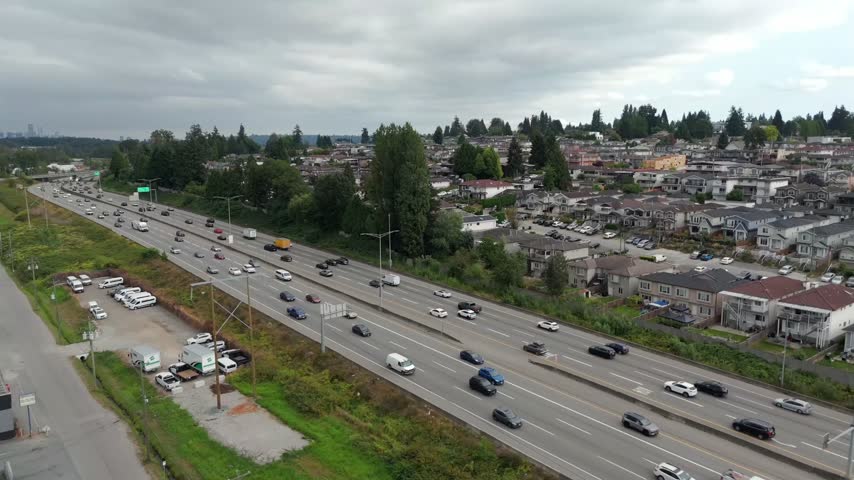 Traffic Moves Along Lougheed Highway At Brentwood Neighbourhood In Burnaby, British Columbia, Canada. Aerial Shot