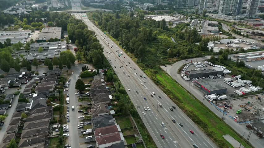 Trans-Canada Highway Through Brentwood In Burnaby, British Columbia With Urban Roadway Within Metro Vancouver, Canada. Aerial Shot