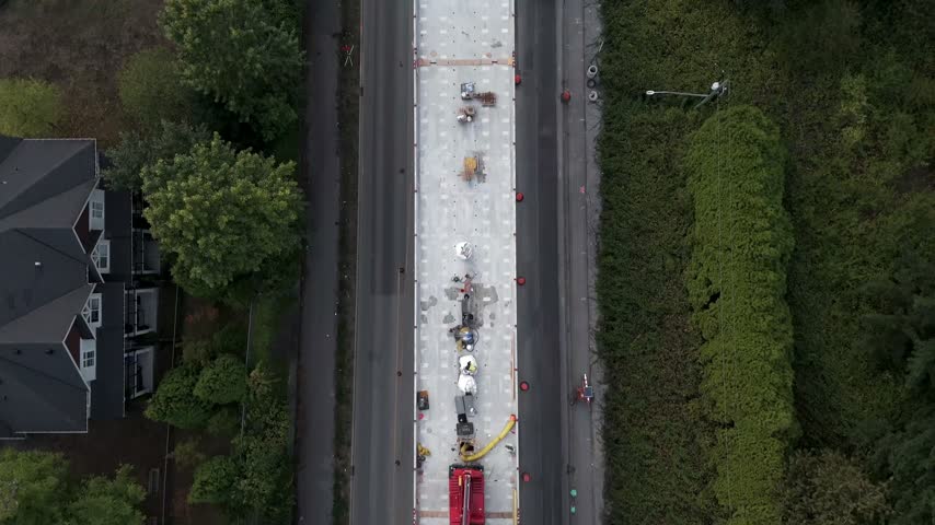 Top-down View Of Concrete Deck Under Construction And A Highway In Surrey, BC, Canada. - aerial shot