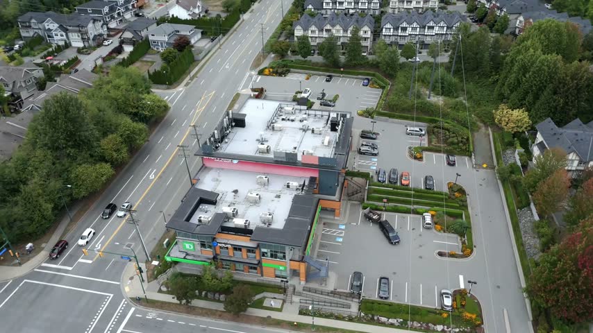 Shopping Plaza At David Avenue In The Burke Mountain Neighbourhood In Coquitlam, BC, Canada. - aerial shot