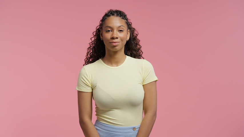 Stylish teen school girl. Young woman looking with smile. Heathy skin and teeth. Portrait of curly hair, gen Z authentic female model.