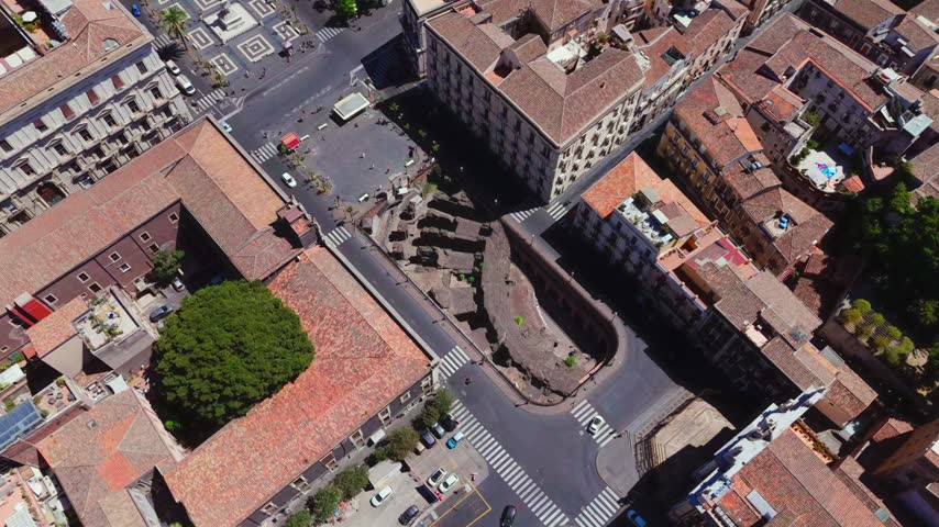 The Roman Amphitheatre of Catania (Anfiteatro Romano di Catania) is an ancient 2nd-century Imperial Roman arena located in Piazza Stesicoro. Built primarily from dark volcanic basalt from Mount Etna.