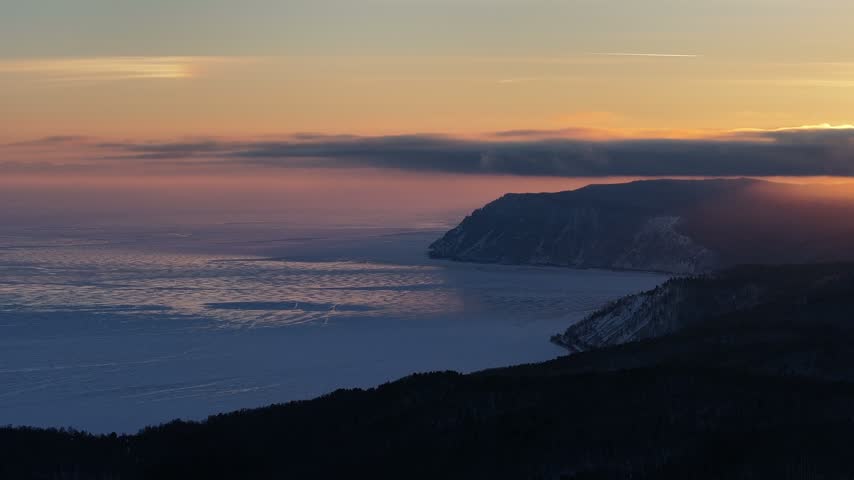 Aerial View of Dramatic Sunset over Lake Baikal and Taiga Cape
