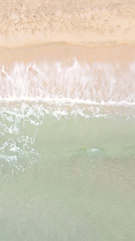 Ocean waves and beach aerial view, natural background.
