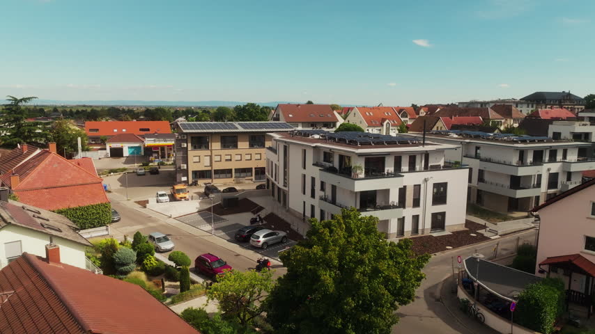 Modern Munich apartment building comes into view as the drone orbits its facade.