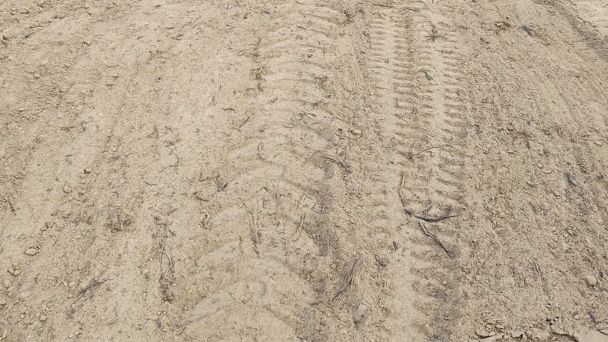 scene of the vehicle mud trail pathway into the farm.