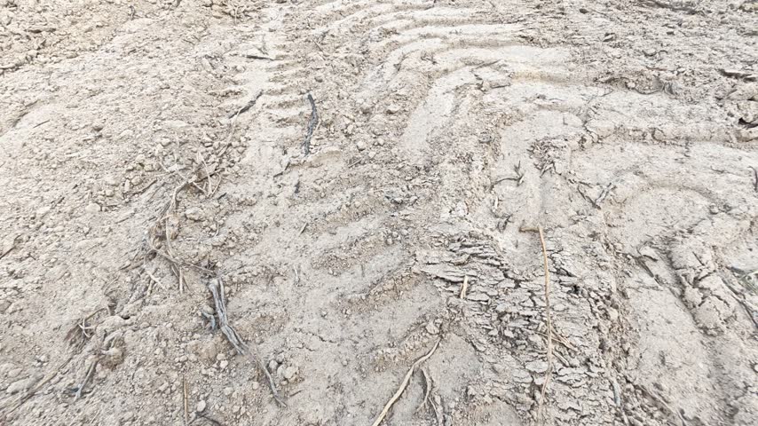scene of the vehicle mud trail pathway into the farm.
