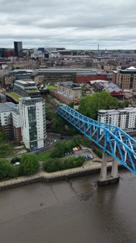 Newcastle Cityscape view with Tyne and Wear Metro passing on Queen Elizabeth II bridge, with city centre and St James