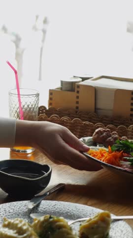 Hungry Woman Receives Kebab Platter From Server At Wooden Dining Table. Female Customer Smiles Cheerfully, Holding Fork Beside Plate Arranged With Grilled Meat, French Fries And Fresh Herbs.