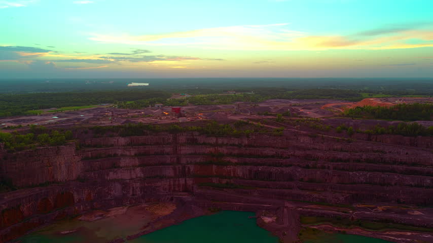 Kentucky limestone quarry seen wide at dusk.