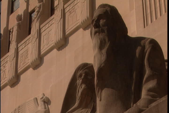 Shot of two figures on the statue The Pioneers by Lorado Taft in Baton Rouge, Louisiana