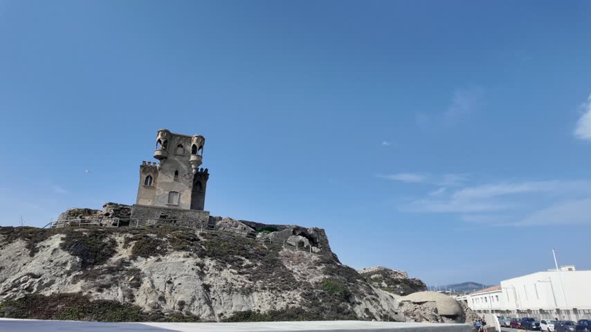 Landmark medieval style tower on a hill at Tarifa beach in Spain