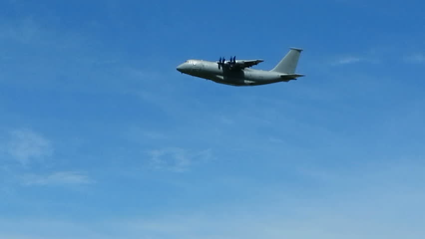 Big freighter aircraft AN-70 on flight. Military airplane in sky