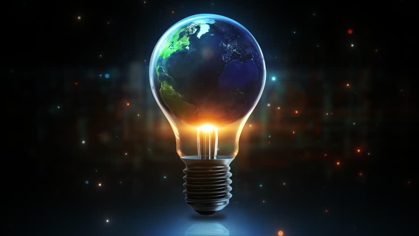 Earth inside a glowing light bulb representing green energy