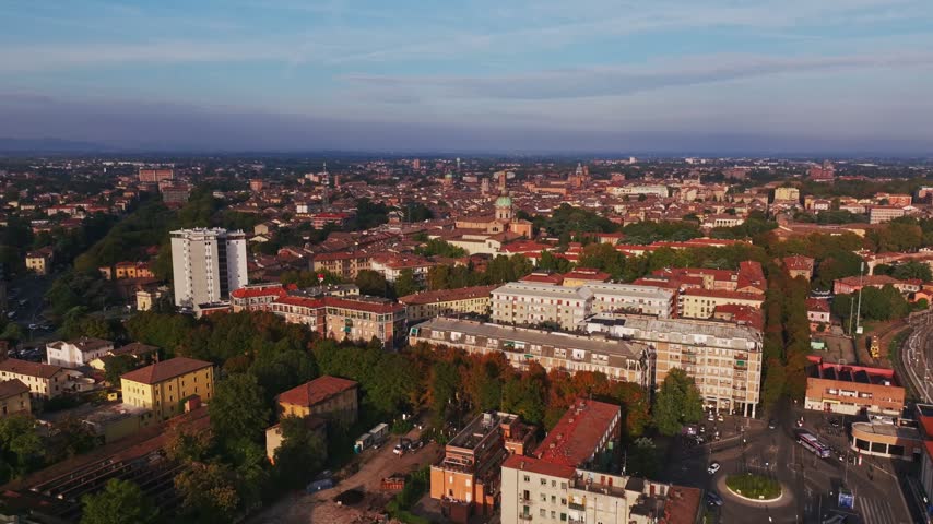 Aerial drone view of Parrocchia di San Pietro in Reggio Emilia, Italy, showcasing the historic church, elegant architecture, bell tower, rooftops, and surrounding cityscape.