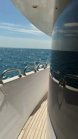 People enjoy a boat ride in Hurghada, Egypt with views of the open sea and blue skies.