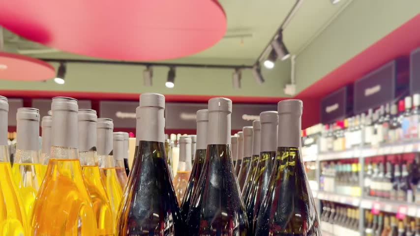 Assorted Alcohol Bottles on Display in Wine Section – Variety of Wine, Spirits and Liquor on Store Shelves