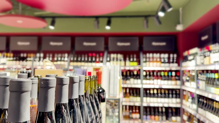 Assorted Alcohol Bottles on Display in Wine Section – Variety of Wine, Spirits and Liquor on Store Shelves