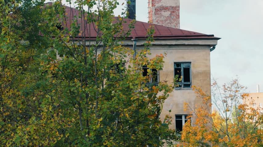 abandoned building with broken windows.