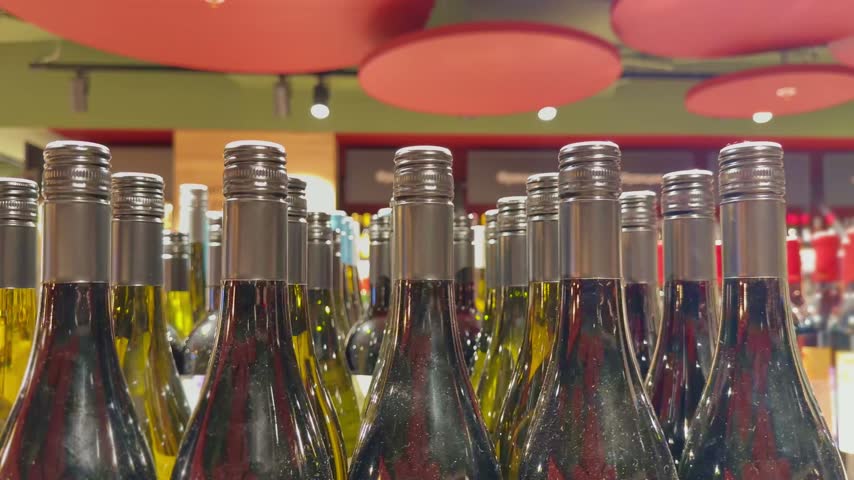 Assorted Alcohol Bottles on Display in Wine Section – Variety of Wine, Spirits and Liquor on Store Shelves