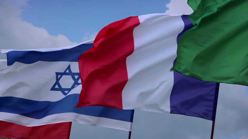 French, Israeli flags on flagstaff. France, Israel negotiations. Wind waving