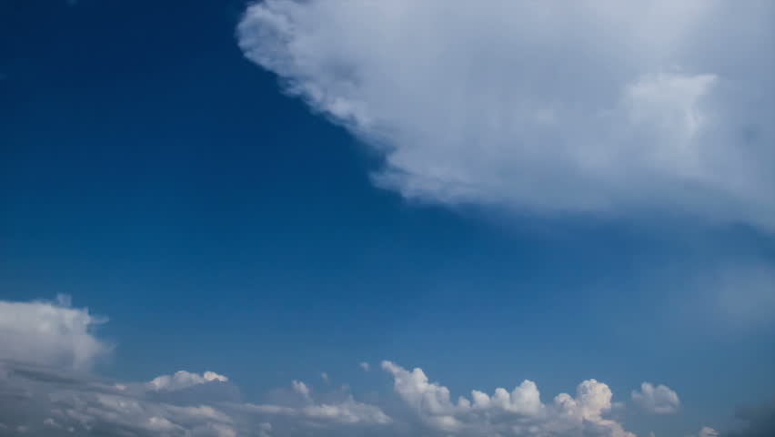 Classic time-lapse of clouds passing by. Blue sunny sky