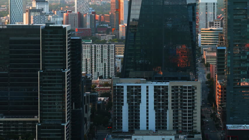 Telephoto Aerial of The Republic Tower and Downtown Austin Streets at Sunset