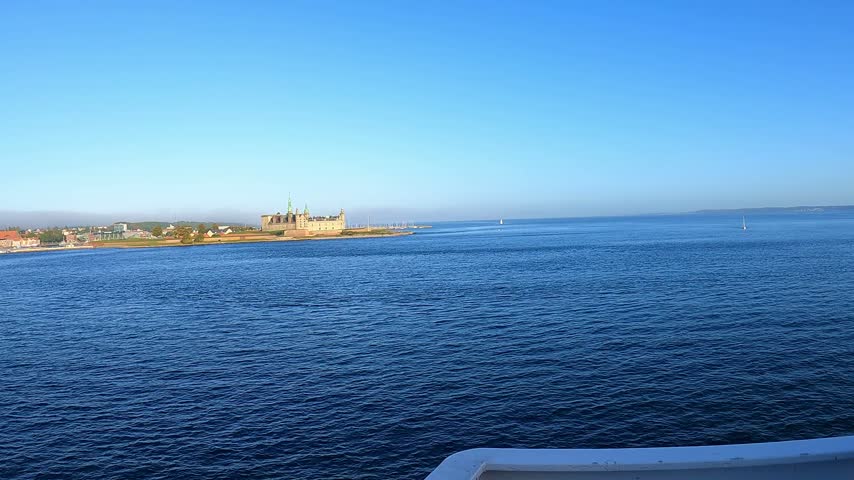 Bearded man on a ferry watching kronborg castle