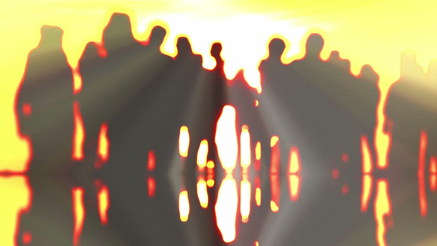 Group of people silhouettes walking at sunset