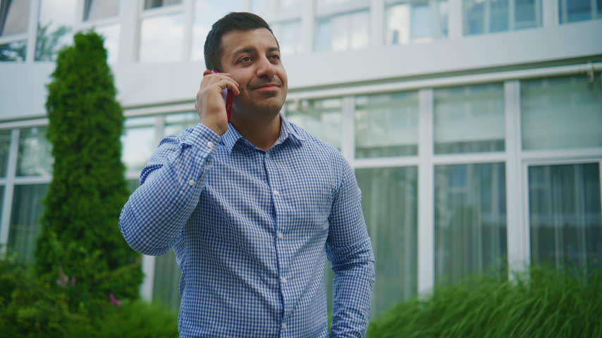 Business conversation outside a modern building during the day