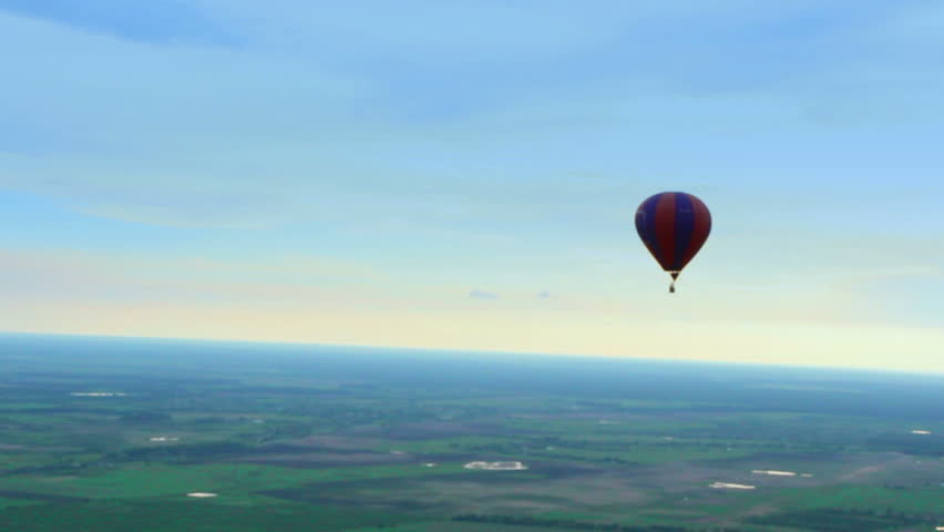 Blue horizon aerial view shot. Air balloon, landscape, pilot pov