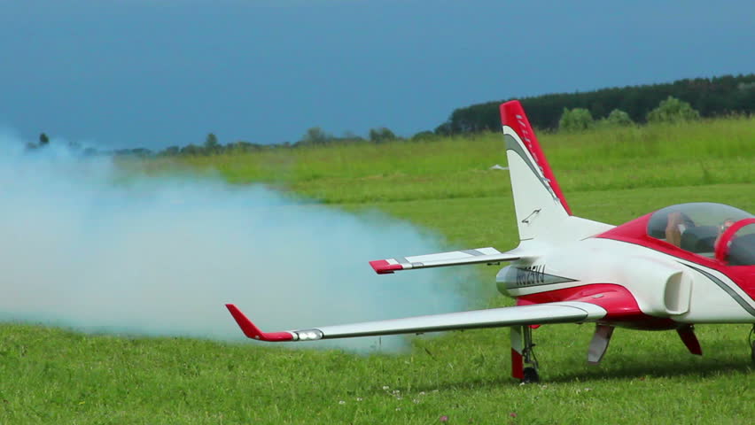 Model of the aircraft landing with smoke from engine