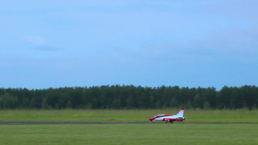 Airplane model takeoff on airshow. Small plane in blue sky.