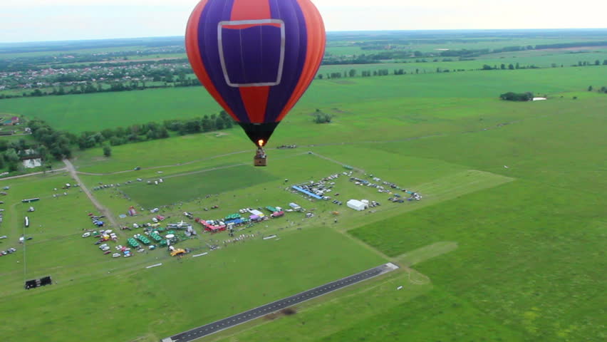 Hot air balloon top aerial view, beautiful landscape and horizon. Pilot POV