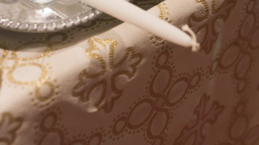 Candle tips on the edge of the religious table used for a marriage.