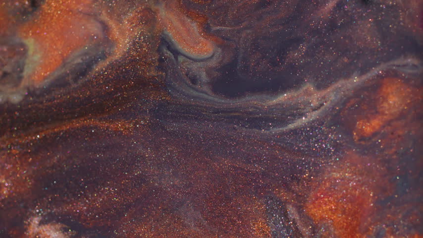 Paint splash. Pigment spill. Defocused orange purple yellow color glitter stone ink geometric particles rhombus floating on abstract art background.