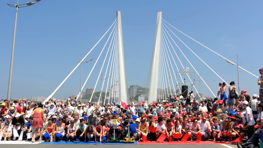 Vladivostok - JULY 07 : People making wave at flashmob on a Golden Bridge. 26904