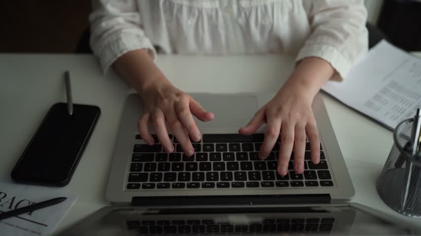 A person types on a laptop. An AI document exchange system classifies and verifies incoming files, connecting project records and archives with operations, finance and customer service.