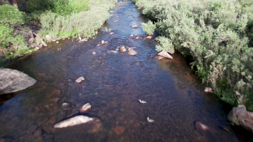 Aerial video of the north saint vrain creek near Apple Valley rd outside of Lyons, Colorado