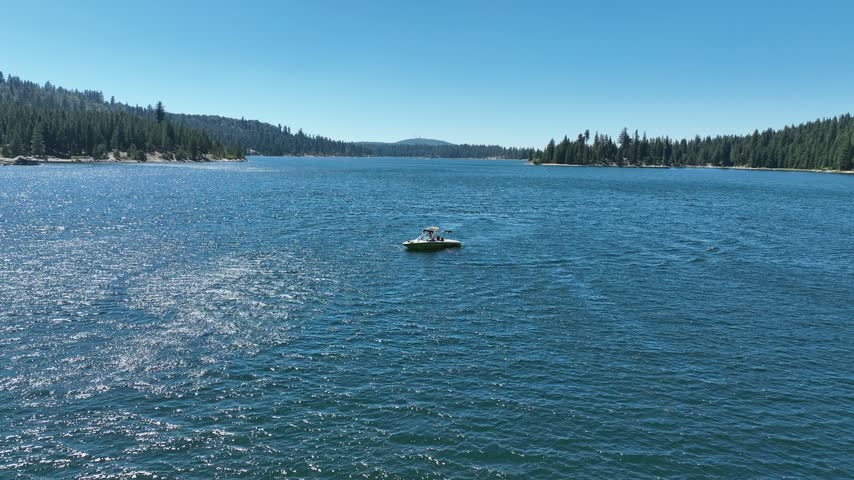 Aerial View as Boat Docked in middle of Lake