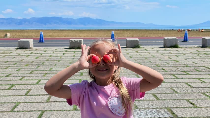 Girl with Red Apples at Sayram Lake, Xinjiang Province, China