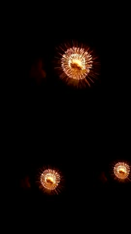 Red Fireworks Exploding with Sparkles on Night Sky for new year Background